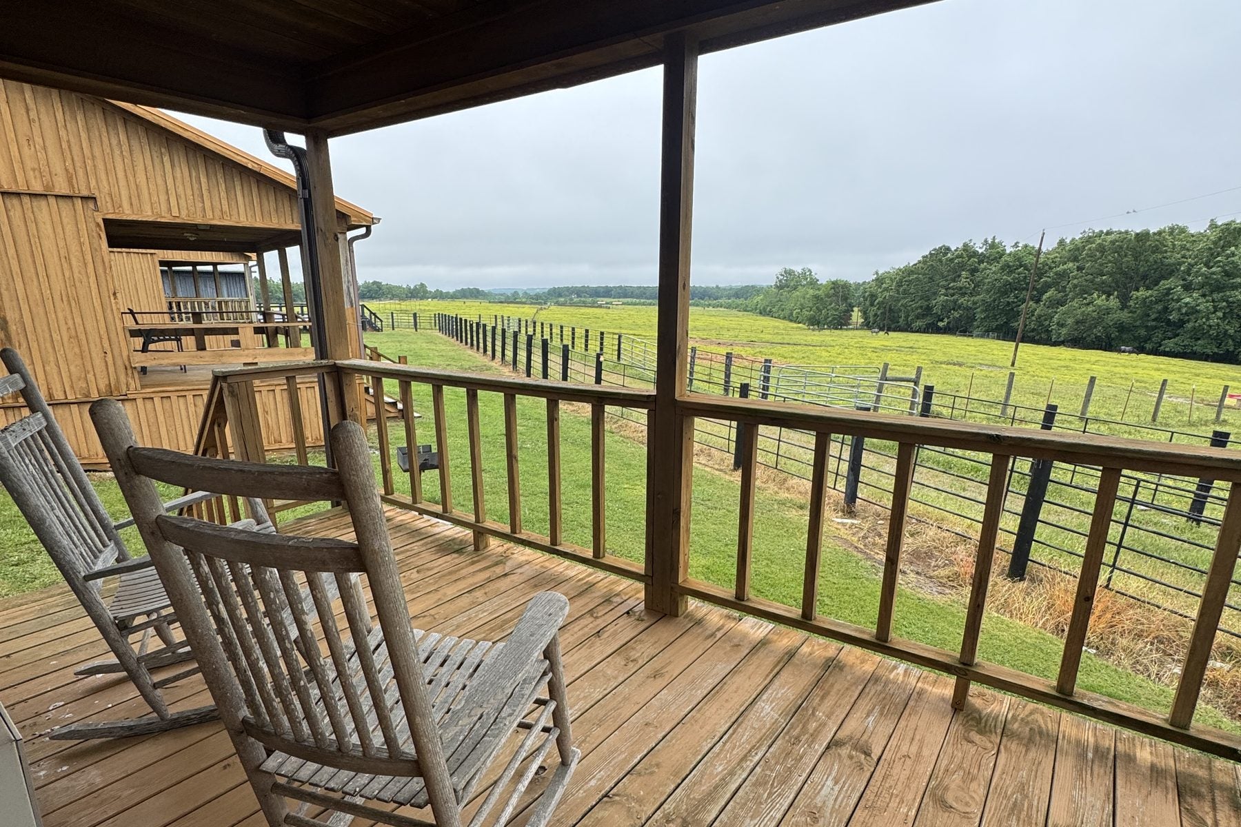 Rocking chairs on the porch overlooking the pasture